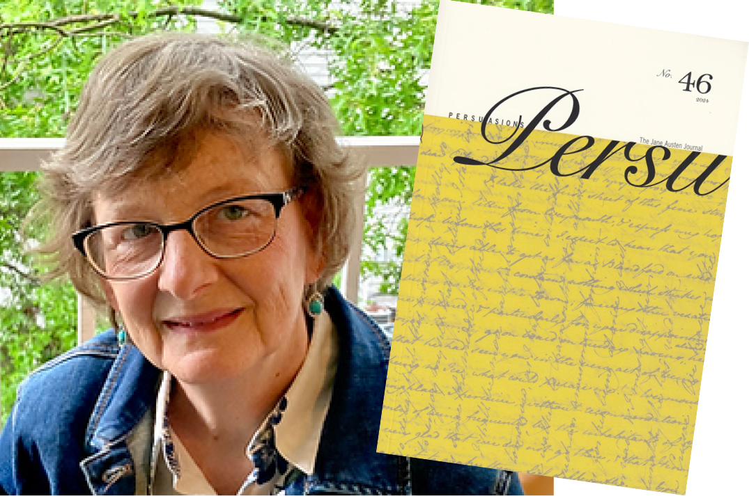 Photograph of a Jane Austen action figurine with bendable arms, a quill pen and a writing desk